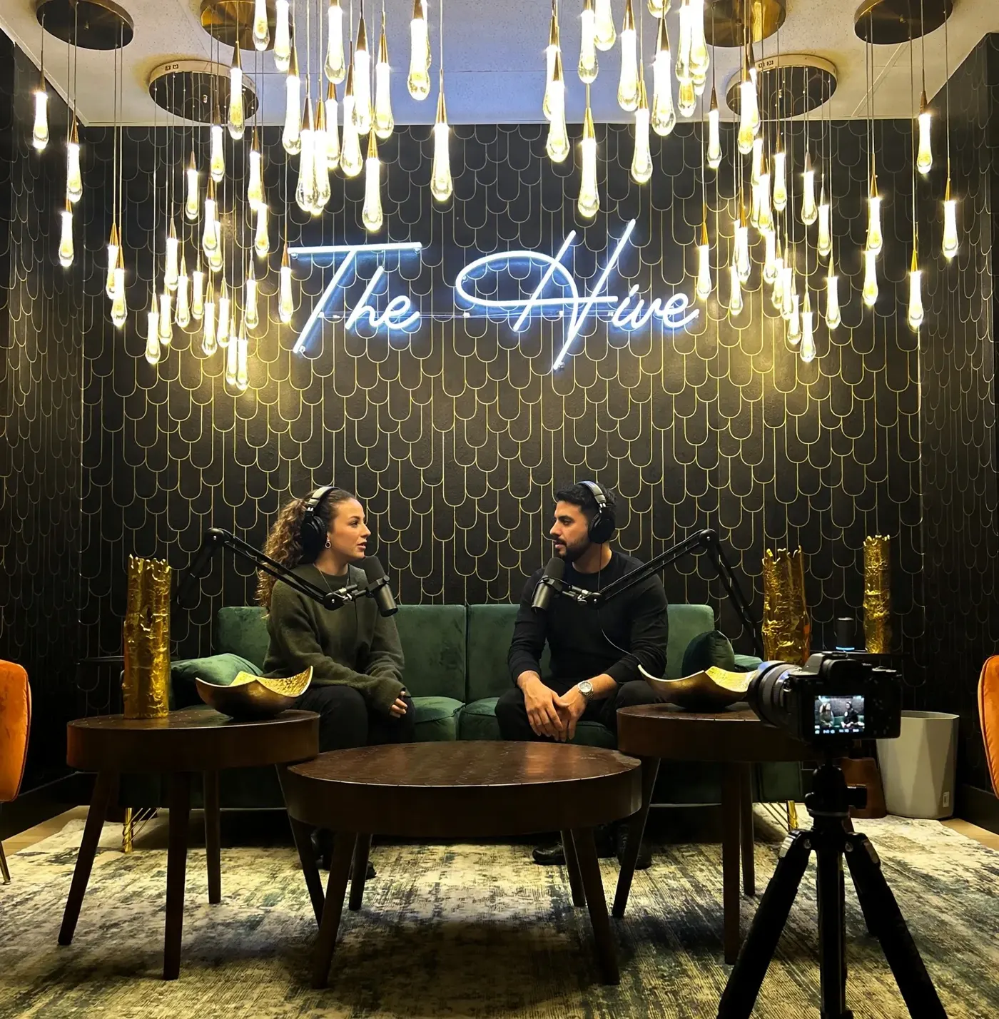 Two people recording an interview in The Hive's podcast studio